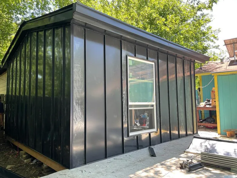 Black standing seam metal wall panels for Roof Inspection in West Bend