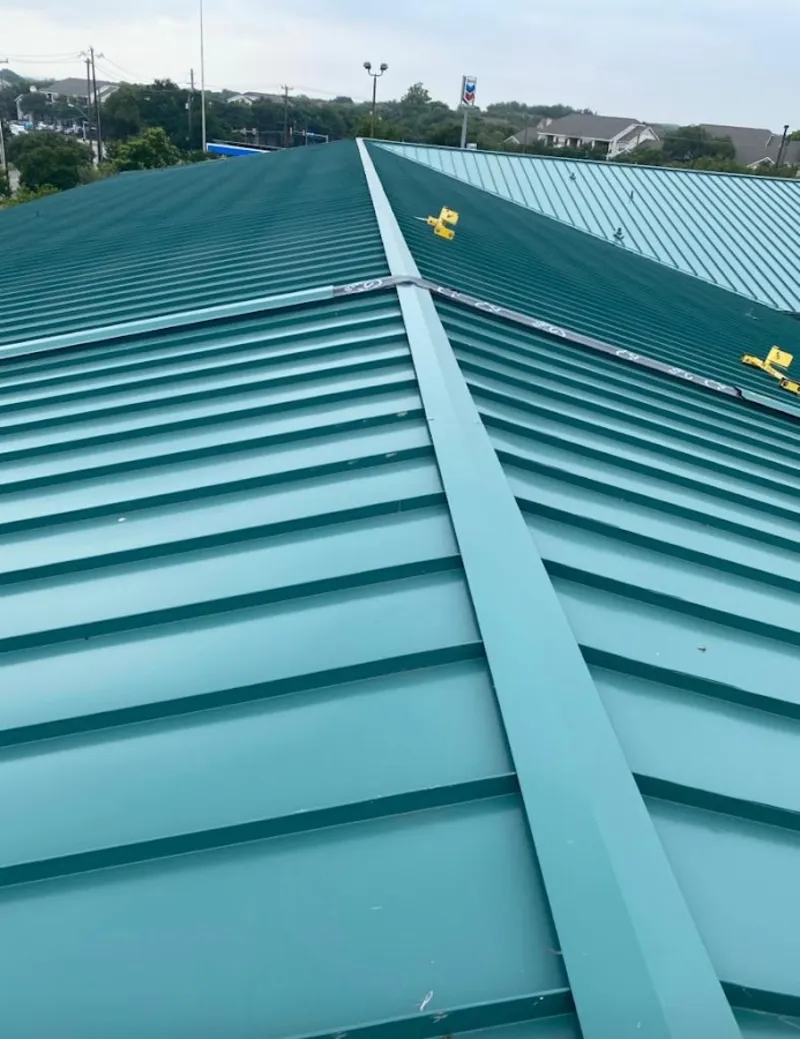 Green commercial metal roof ridge and valley for Metal Roof Repair in West Bend